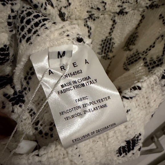 AREA eye crochet knit pants featuring crystal flower applique - Picture 11 of 12